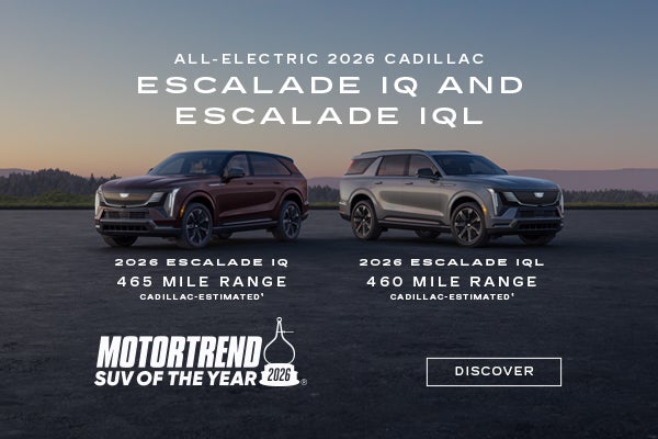 2026 Cadillac Escalade IQ and IQL, MotorTrend SUV of the Year, displayed in metallic silver on a ...